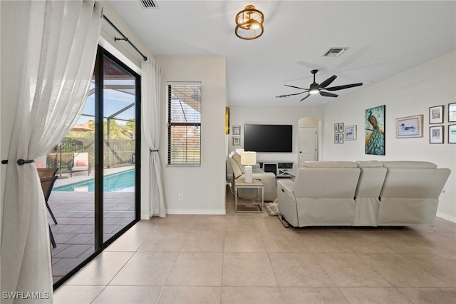 living room featuring ceiling fan and light tile patterned flooring