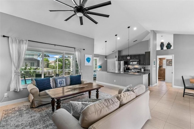 tiled living room featuring ceiling fan and high vaulted ceiling