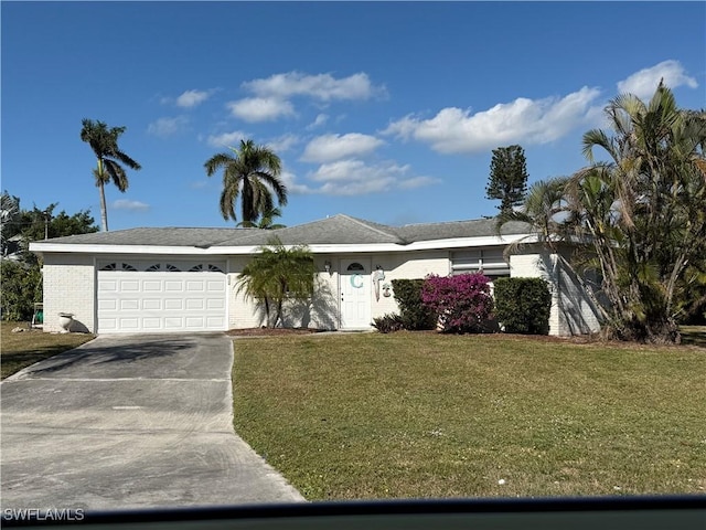 single story home featuring a front yard and a garage