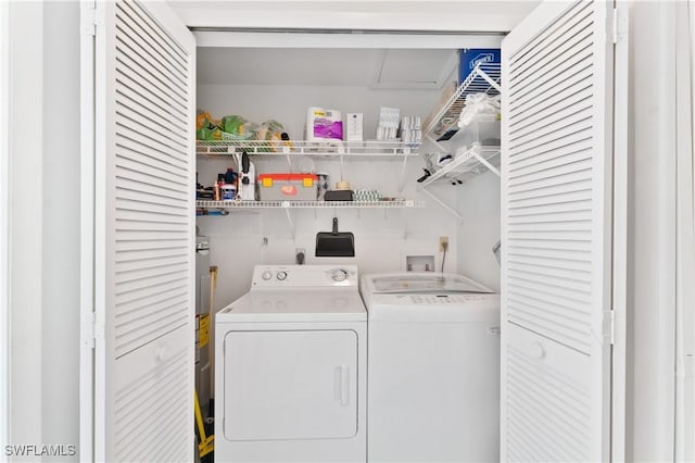 clothes washing area with independent washer and dryer