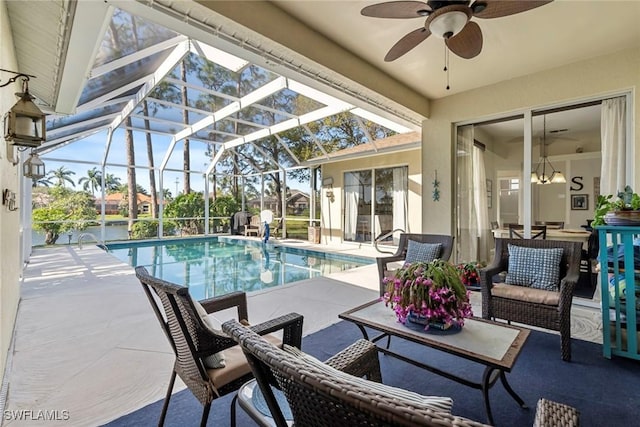 view of pool featuring ceiling fan, a lanai, a patio, and an outdoor hangout area