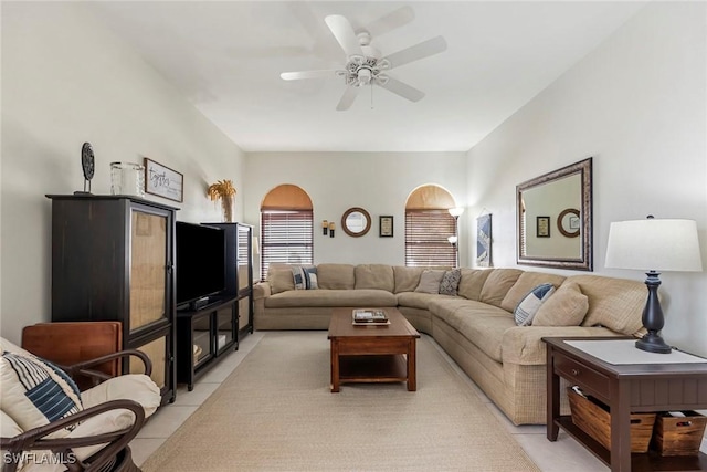 tiled living room with ceiling fan