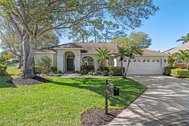 ranch-style home featuring a front yard and a garage