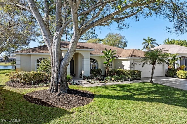 ranch-style home featuring a front lawn and a garage