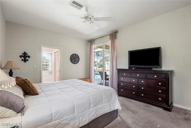 carpeted bedroom featuring access to outside, ensuite bath, and ceiling fan