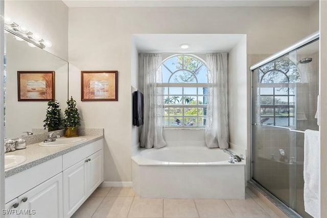 bathroom with vanity, tile patterned floors, and separate shower and tub