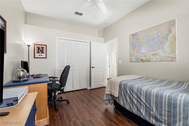 bedroom featuring a closet, ceiling fan, and dark hardwood / wood-style floors