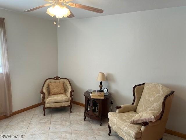 sitting room with ceiling fan