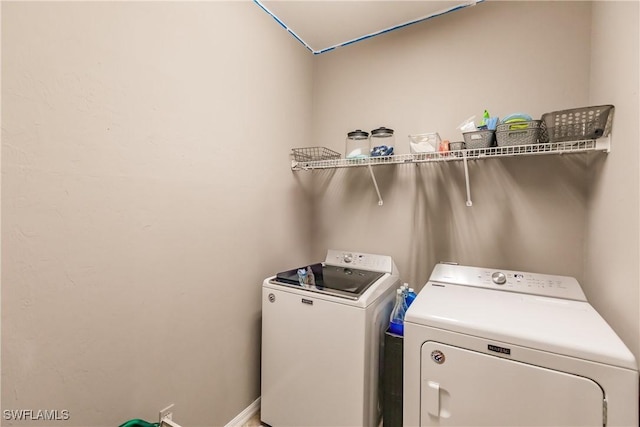 laundry room with washer and clothes dryer