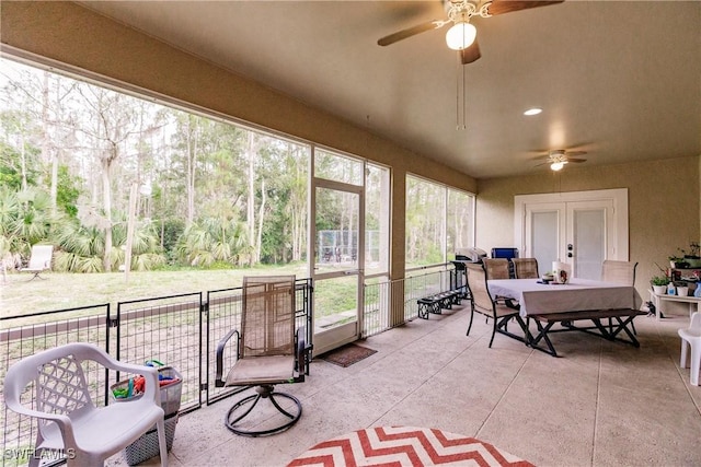 sunroom / solarium with ceiling fan