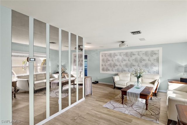 sitting room with light hardwood / wood-style flooring