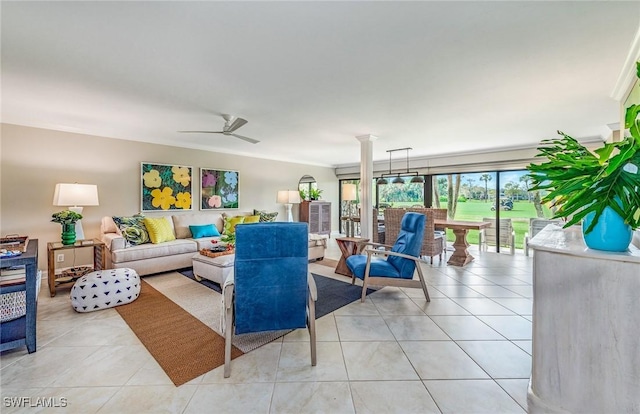 living area featuring light tile patterned floors, ornamental molding, and ceiling fan