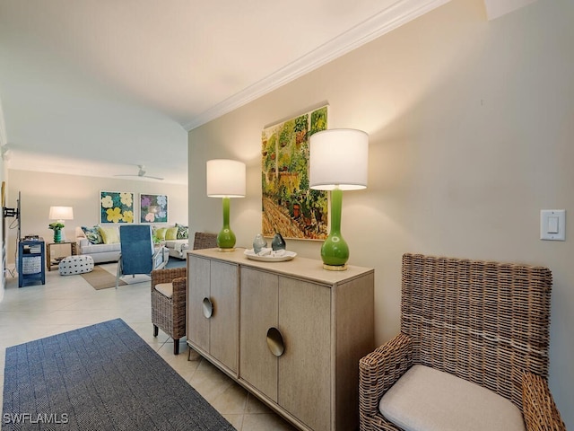 interior space featuring ceiling fan, light tile patterned floors, and crown molding