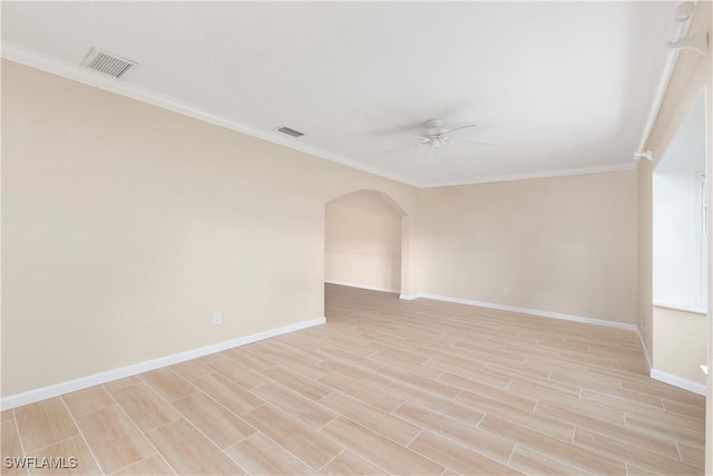 empty room with ceiling fan and ornamental molding