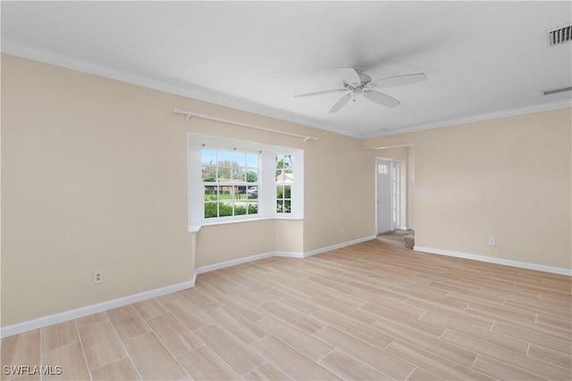 spare room with ceiling fan, ornamental molding, and light wood-type flooring