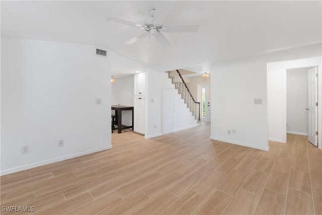 unfurnished living room with vaulted ceiling, ceiling fan, and light hardwood / wood-style floors