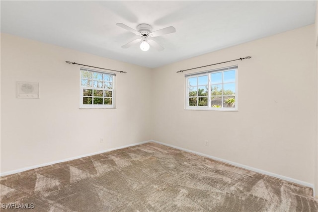 unfurnished room with carpet flooring and ceiling fan