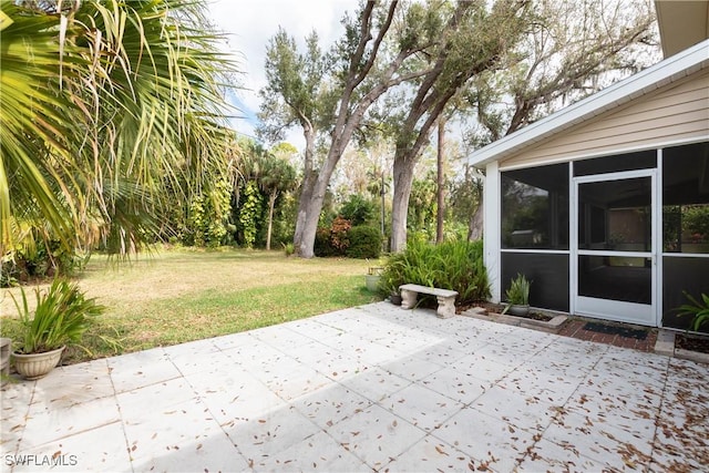 view of patio with a sunroom