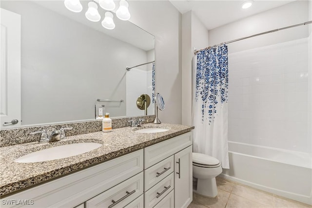 full bathroom featuring tile patterned floors, vanity, toilet, and shower / bathtub combination with curtain