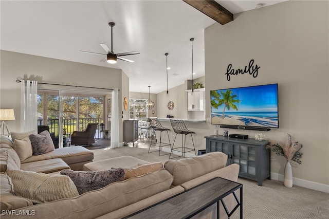 living room featuring vaulted ceiling with beams, light colored carpet, and ceiling fan