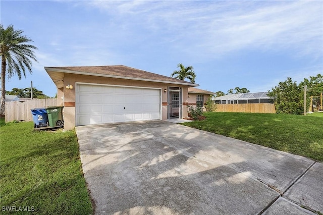 view of front of home featuring a front yard and a garage