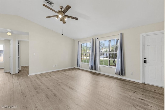 interior space featuring light hardwood / wood-style flooring, vaulted ceiling, and ceiling fan