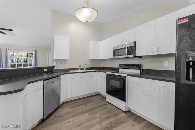 kitchen featuring white cabinets, ceiling fan, sink, and appliances with stainless steel finishes