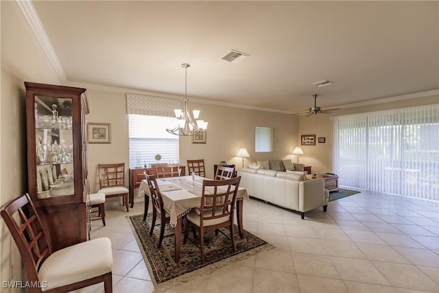 dining space with crown molding, light tile patterned floors, and ceiling fan with notable chandelier