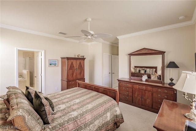 bedroom featuring ceiling fan, crown molding, ensuite bathroom, and light colored carpet