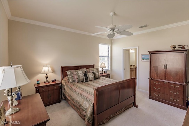 carpeted bedroom featuring ensuite bath, ceiling fan, and ornamental molding