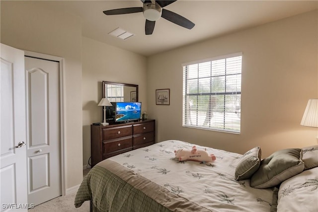 carpeted bedroom with ceiling fan