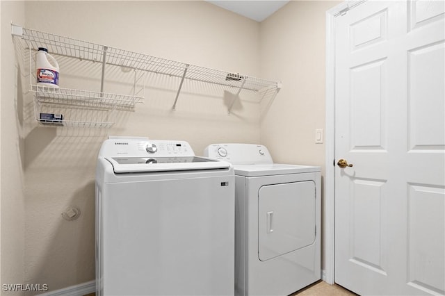 laundry area featuring independent washer and dryer