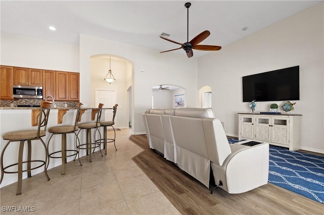 living room with ceiling fan