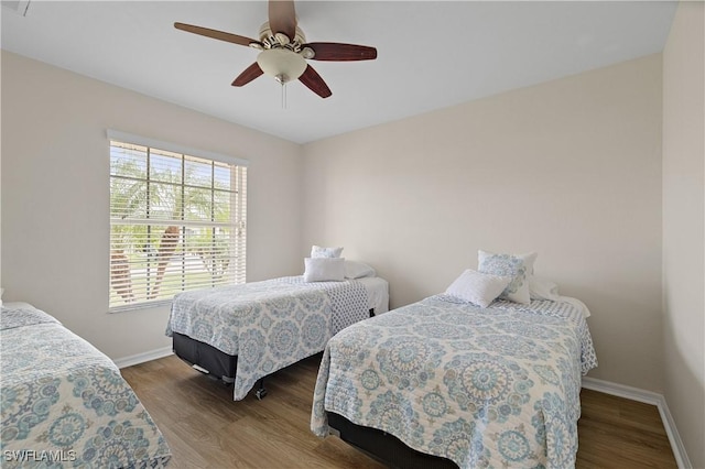 bedroom with ceiling fan and wood-type flooring