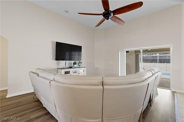 living room with hardwood / wood-style floors and ceiling fan