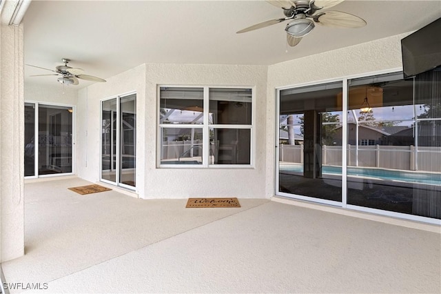 exterior space featuring ceiling fan