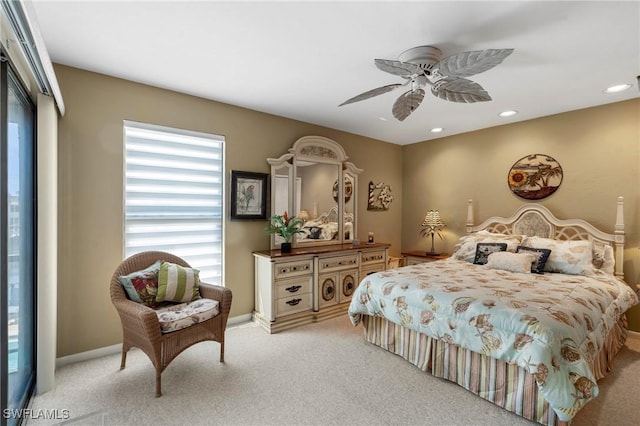 bedroom featuring ceiling fan and light carpet