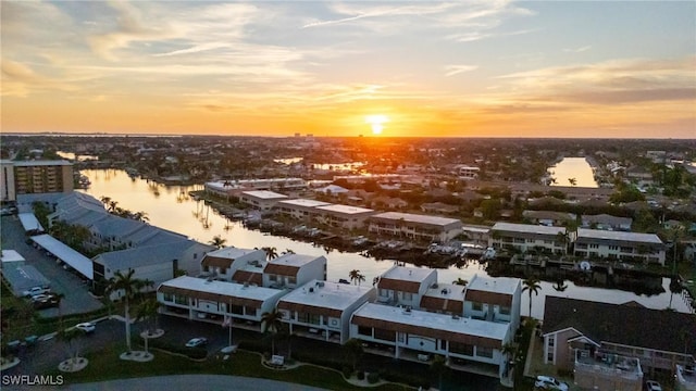 aerial view at dusk with a water view