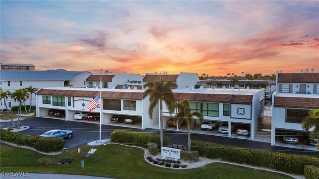 view of outdoor building at dusk