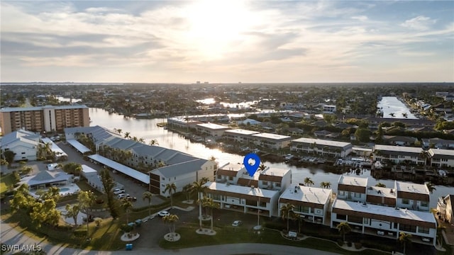 aerial view at dusk with a water view