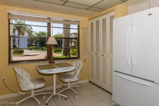 tiled dining area with a healthy amount of sunlight