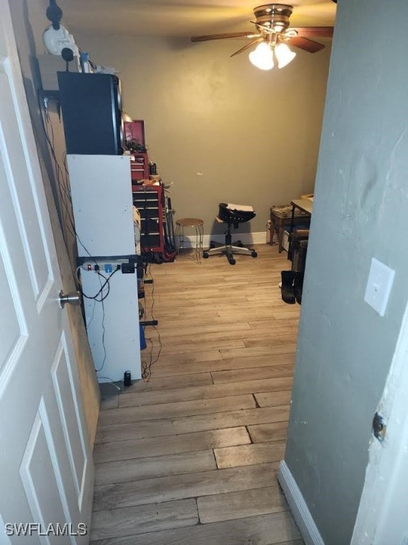 interior space featuring ceiling fan and wood-type flooring