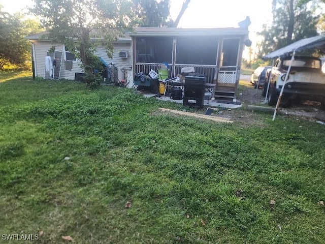 view of yard with a sunroom