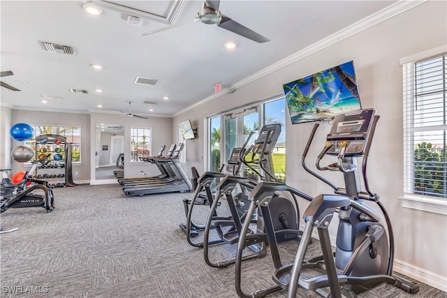 workout area featuring ornamental molding, visible vents, and ceiling fan