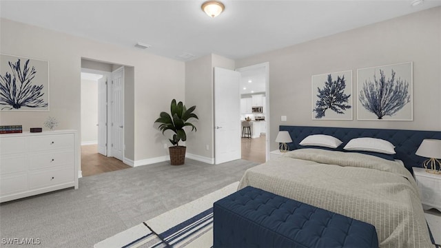 bedroom featuring carpet floors and baseboards