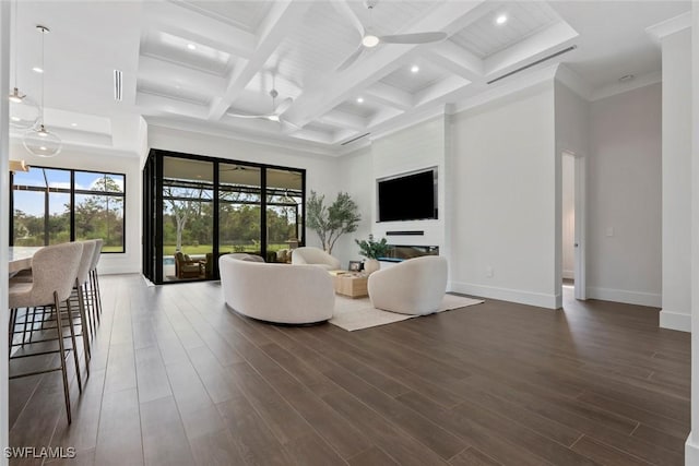 living room with a high ceiling, coffered ceiling, dark wood-type flooring, and beam ceiling