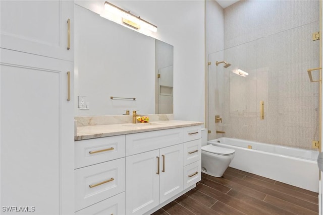 full bathroom featuring vanity, shower / washtub combination, and toilet