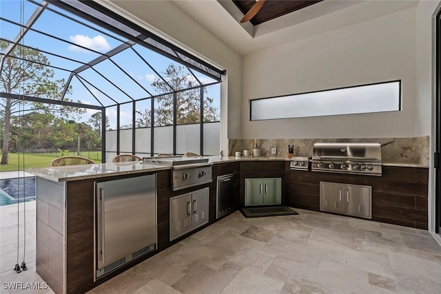 view of patio / terrace featuring area for grilling, grilling area, and glass enclosure