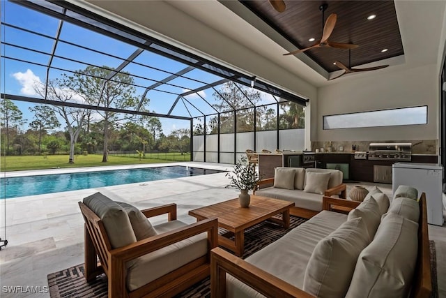 view of swimming pool with ceiling fan and area for grilling