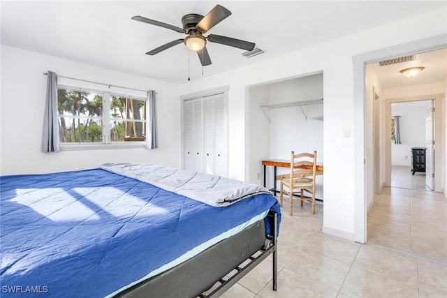 bedroom featuring ceiling fan and light tile patterned flooring